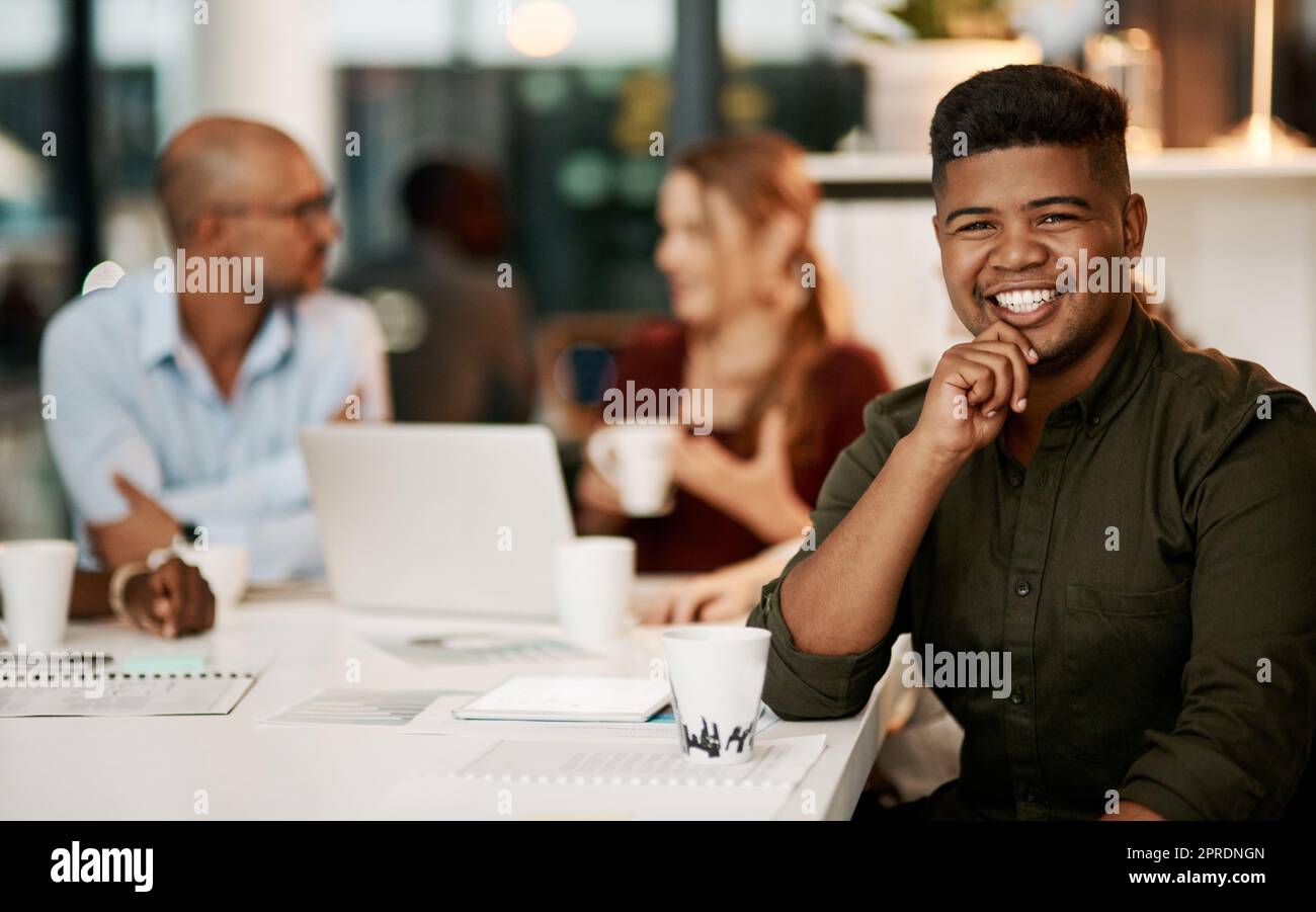 Excited, ambitious and motivated business man in team meeting, group training and strategy discussion in office boardroom. Portrait of smiling, happy and inspired creative with an innovation vision Stock Photo