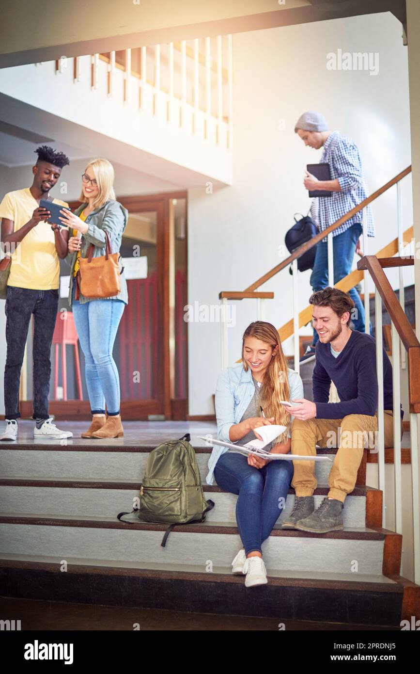 Another day devoted to their studies. university students at campus. Stock Photo