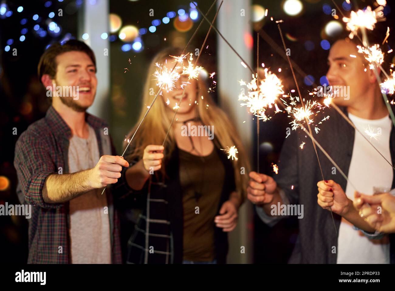 Adding some sparkle to the evening. a group of friends having fun at a nightclub. Stock Photo