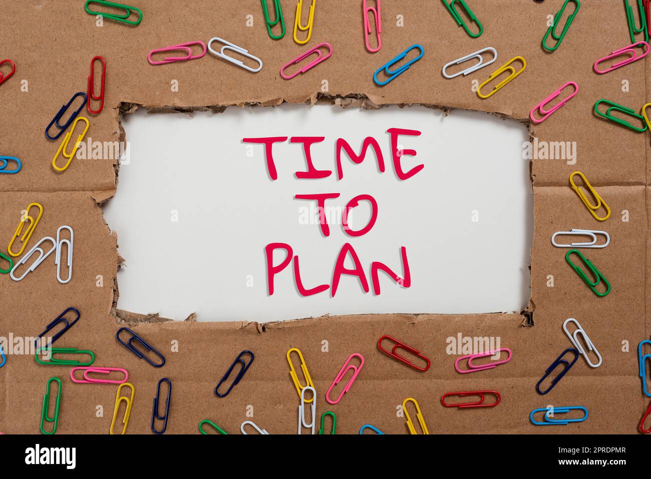 Inspiration showing sign Time To Plan. Business approach Preparation of things Getting Ready Think other solutions Important Ideas Written Under Ripped Cardboard With Paperclips Around. Stock Photo