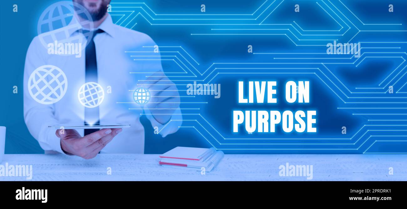Text showing inspiration Live On Purpose. Business approach Have a goal mission motivation to keep going inspiration Businessman Holding Tablet And Presenting Crutial Messages In Office. Stock Photo