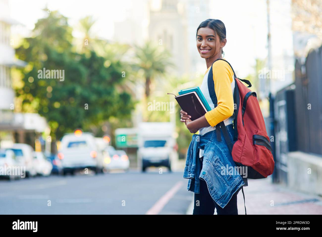 All set and ready to go to college. a young female student commuting to college in the city. Stock Photo