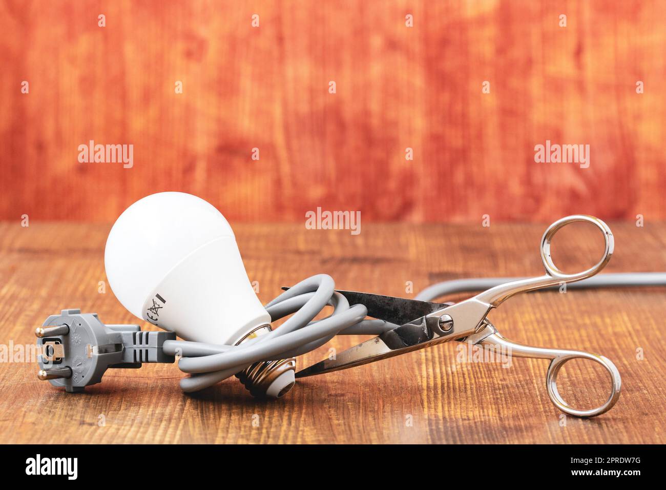 Cutting the electrical cable with scissors Stock Photo Alamy