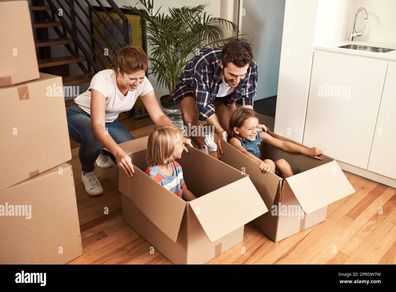 As long as were together, were home. a young family on their moving day. Stock Photo