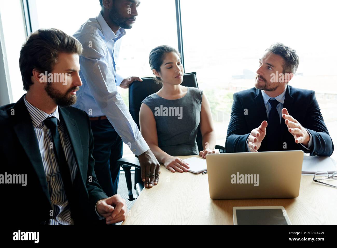 Thinking, talking and leadership team collaboration of business workers in a boardroom meeting. Serious office group work together on finance strategy. Corporate investment team working on a project Stock Photo