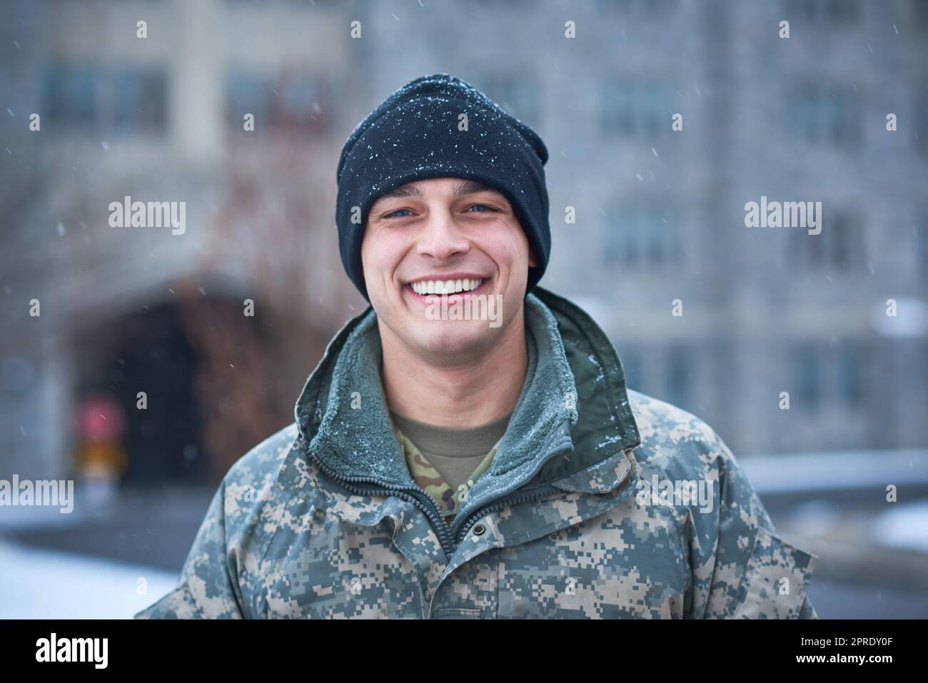 I joined the institute of heroes. a young soldier standing outside on a ...