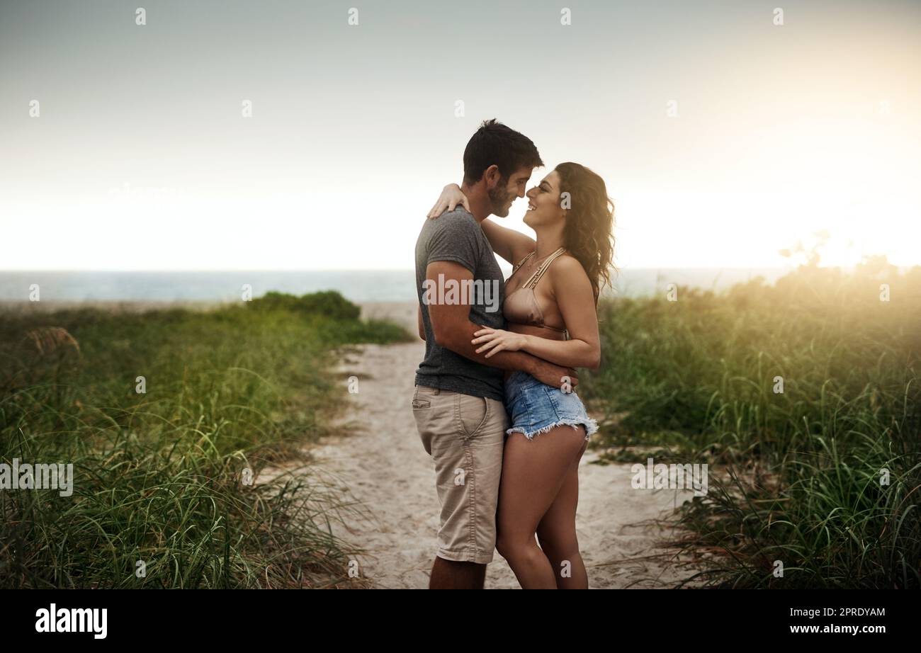 Nothing says summer romance like a day at the beach. a young couple spending a romantic day at the beach. Stock Photo