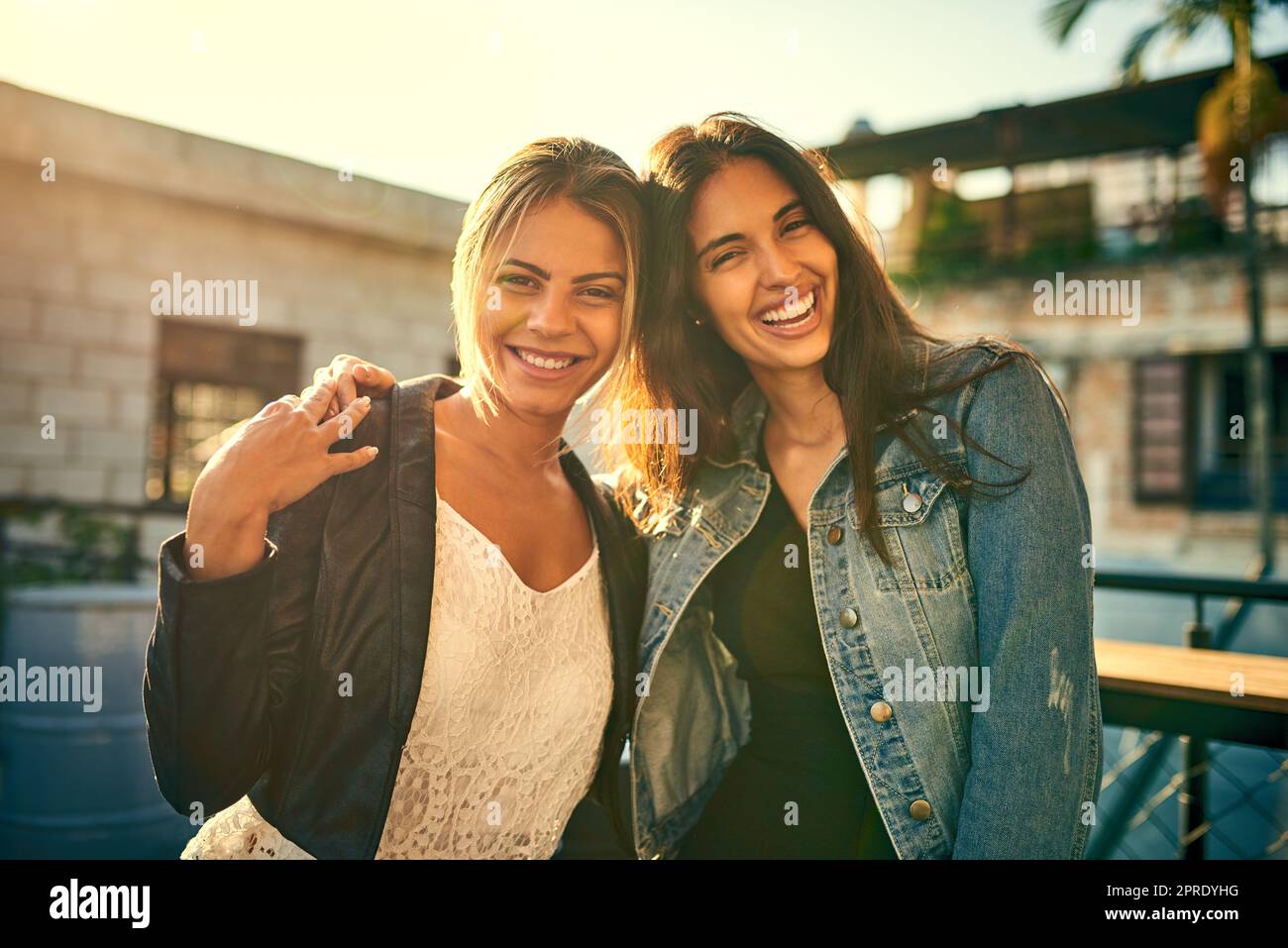 Its always the best time with my best friend. Portrait of two female friends spending the day outside on a rooftop. Stock Photo