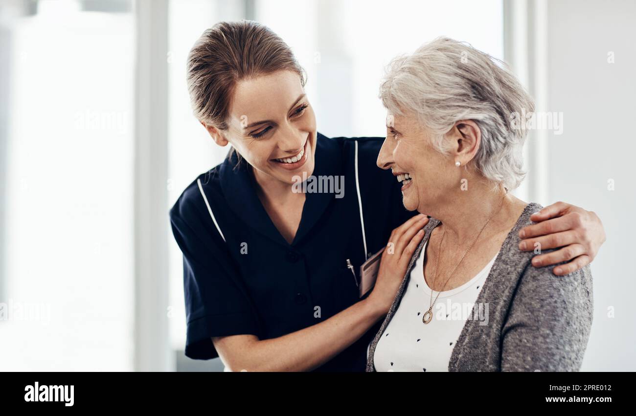 Her wellbeing is my first priority. a female nurse caring for a senior ...