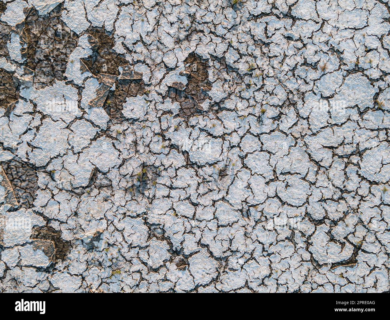 Geology.Dried-up riverbeds and lakes. Drought, global warming and climate change. Cracked dry earth and soil.Dry desert, drought season. Idea concept symbol disaster ecology in nature. Stock Photo