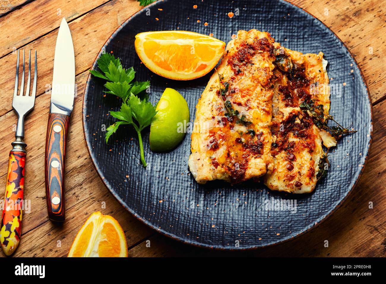 Fried fish fillets in orange oil Stock Photo Alamy
