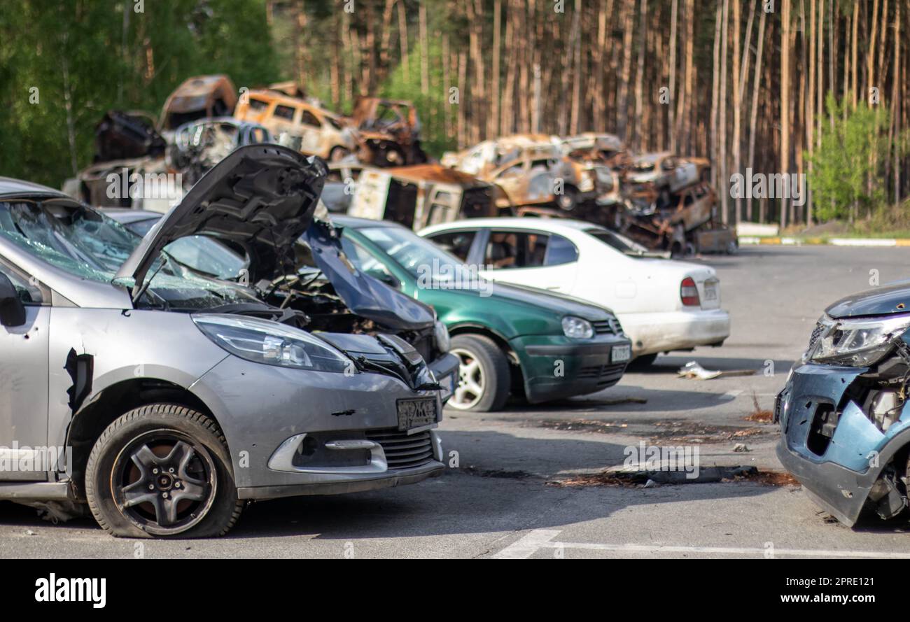 Shot, damaged cars during the war in Ukraine. The civilian car was damaged. Shrapnel and bullet
