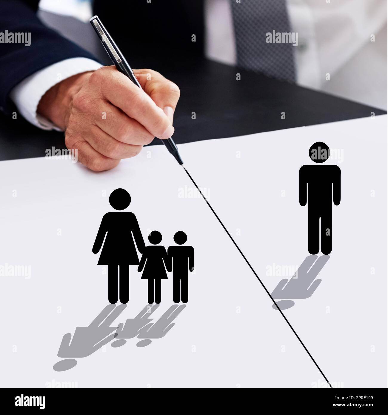 The lines have been drawn in the custody battle. a businessman drawing a dividing line between a father, his children and their mother. Stock Photo