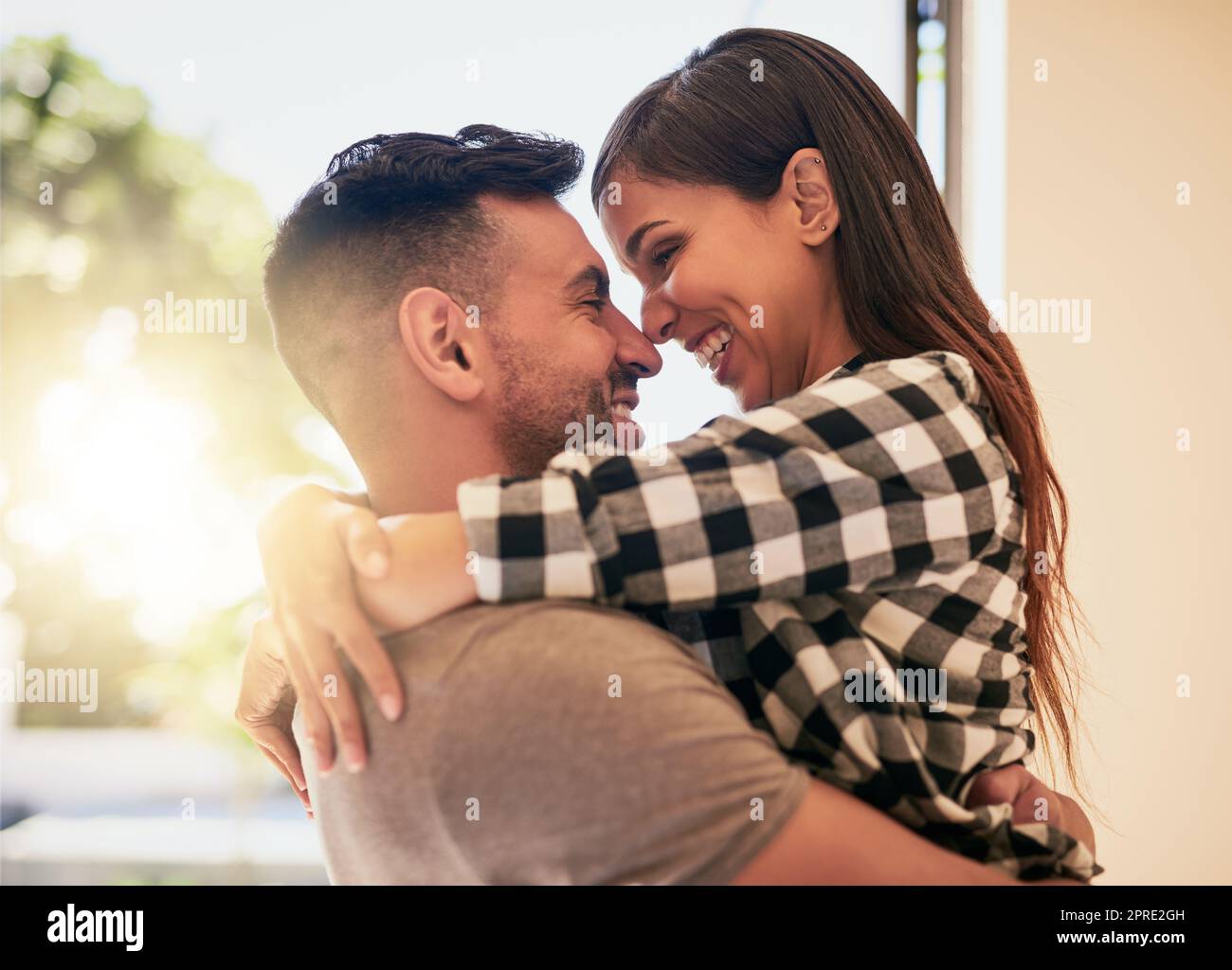 You fill my heart with so much happiness. an affectionate young couple bonding at home. Stock Photo