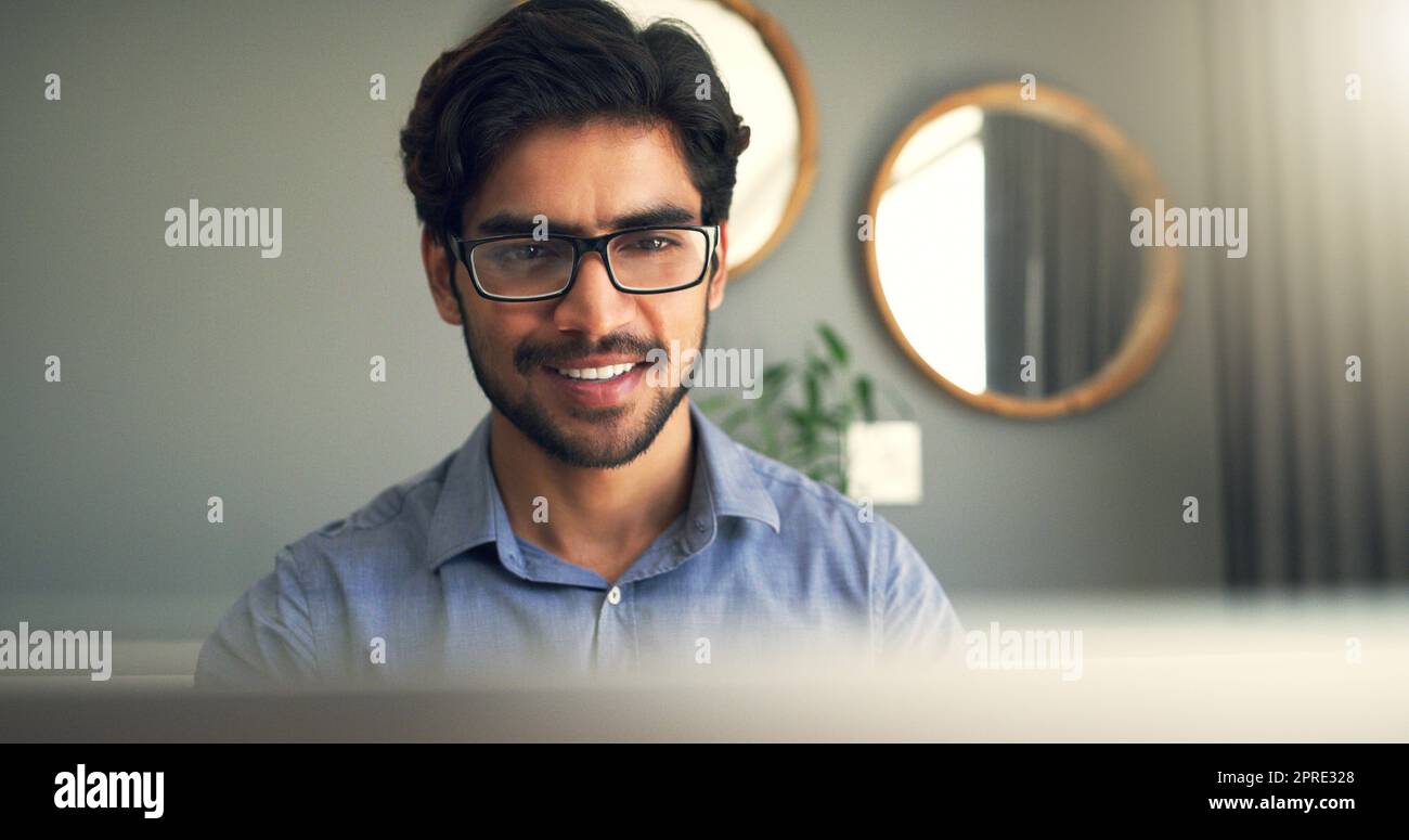 Work ethic starts at home. a handsome young businessman working at home. Stock Photo