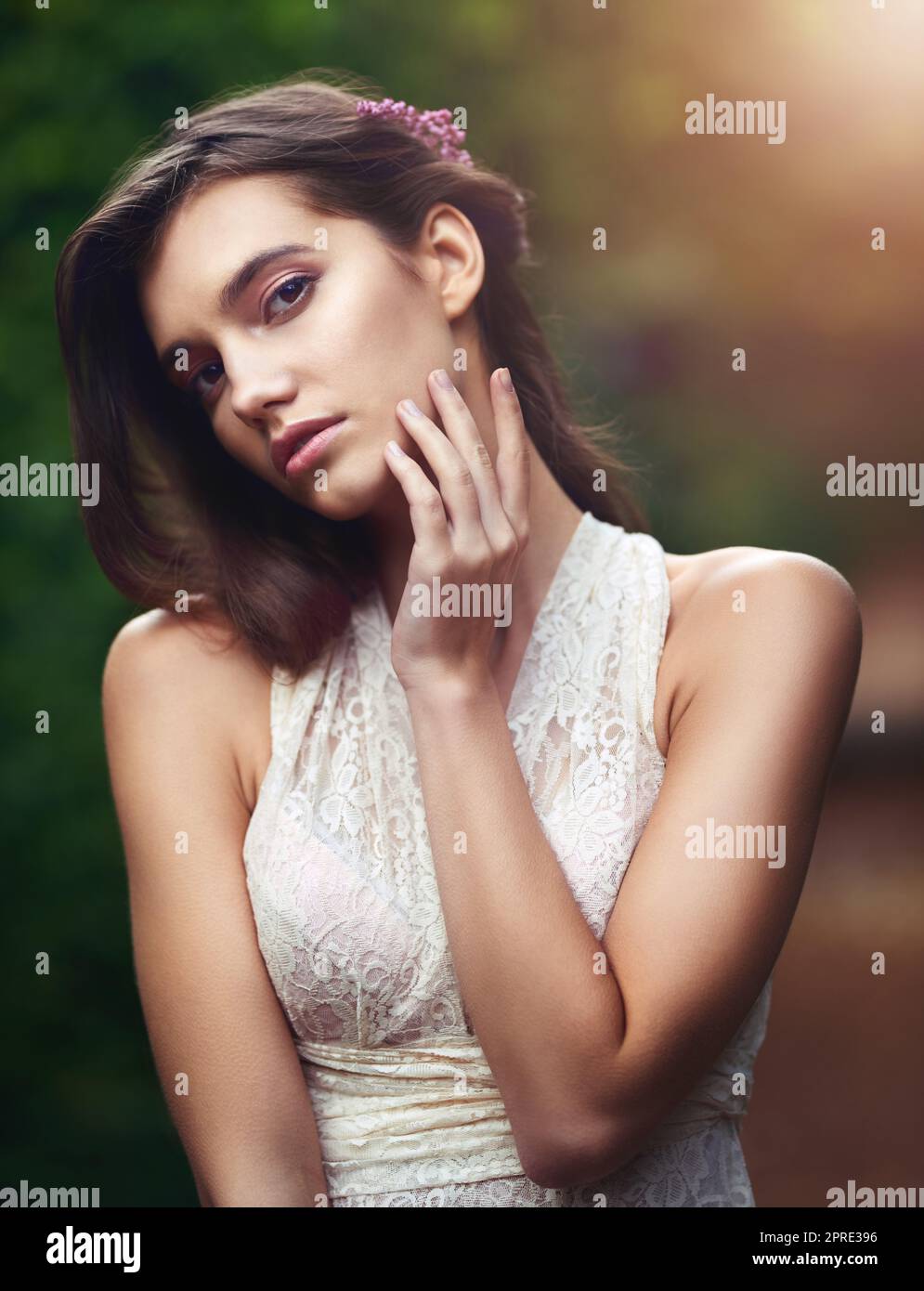 Flaunt your femininity. a beautiful young woman posing in nature. Stock Photo