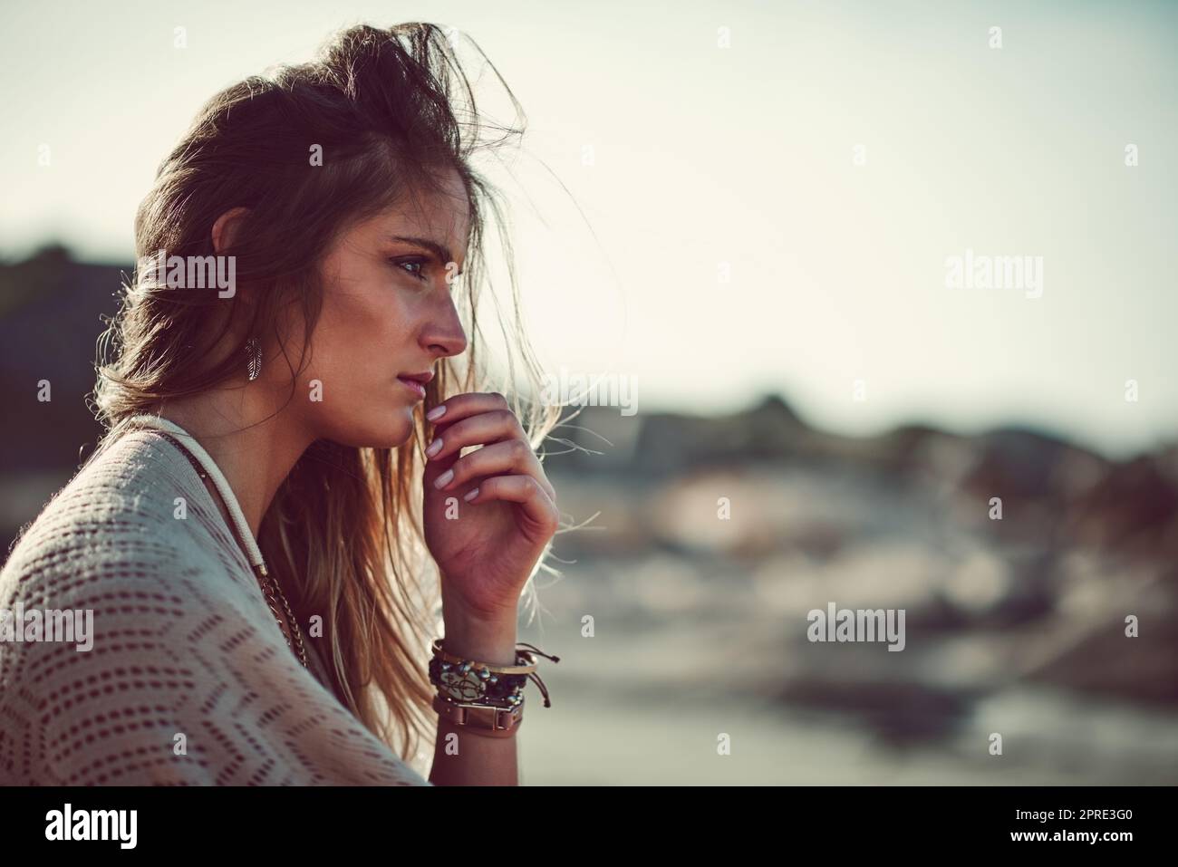 The beach is a great place to find inner peace. an attractive young woman spending a day at the beach. Stock Photo