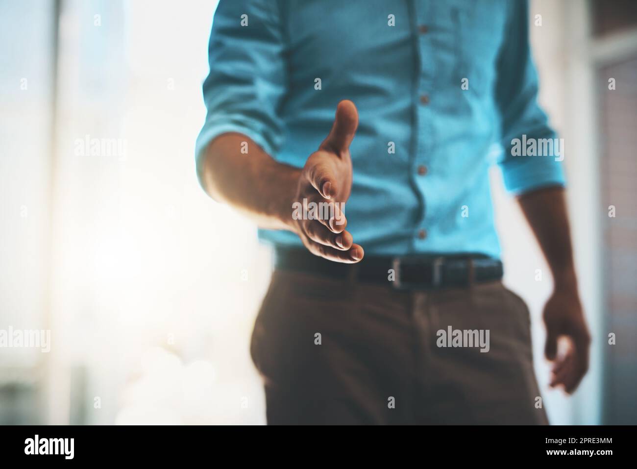 Welcome, my name is. a businessman extending his arm for a handshake. Stock Photo