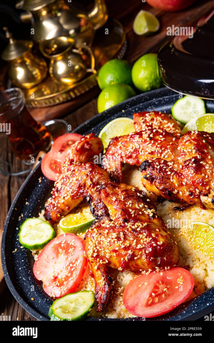 couscous with fried chicken wings spicy Stock Photo Alamy
