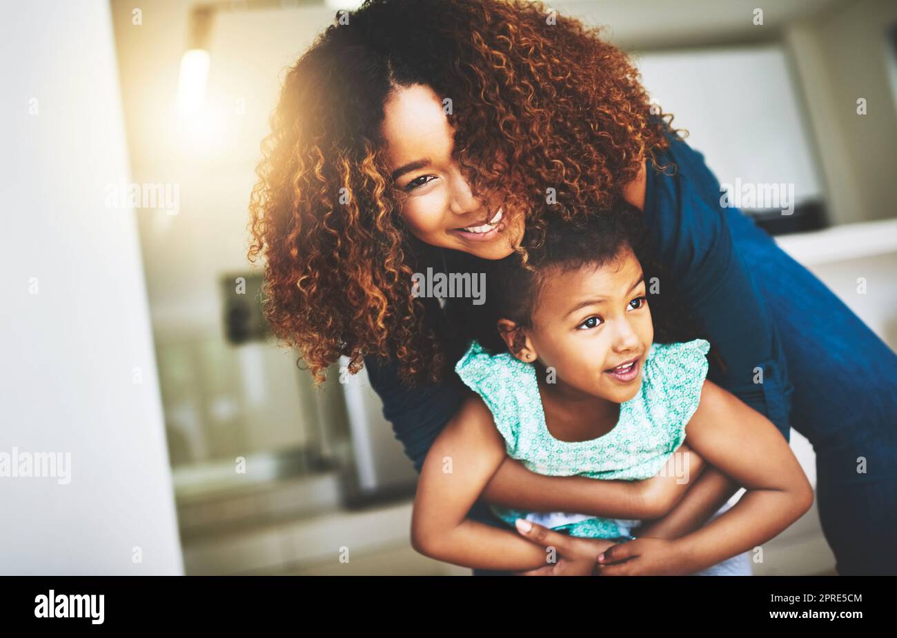 Motherhood is knowing joy. a young mother and her daughter spending quality time together at home. Stock Photo
