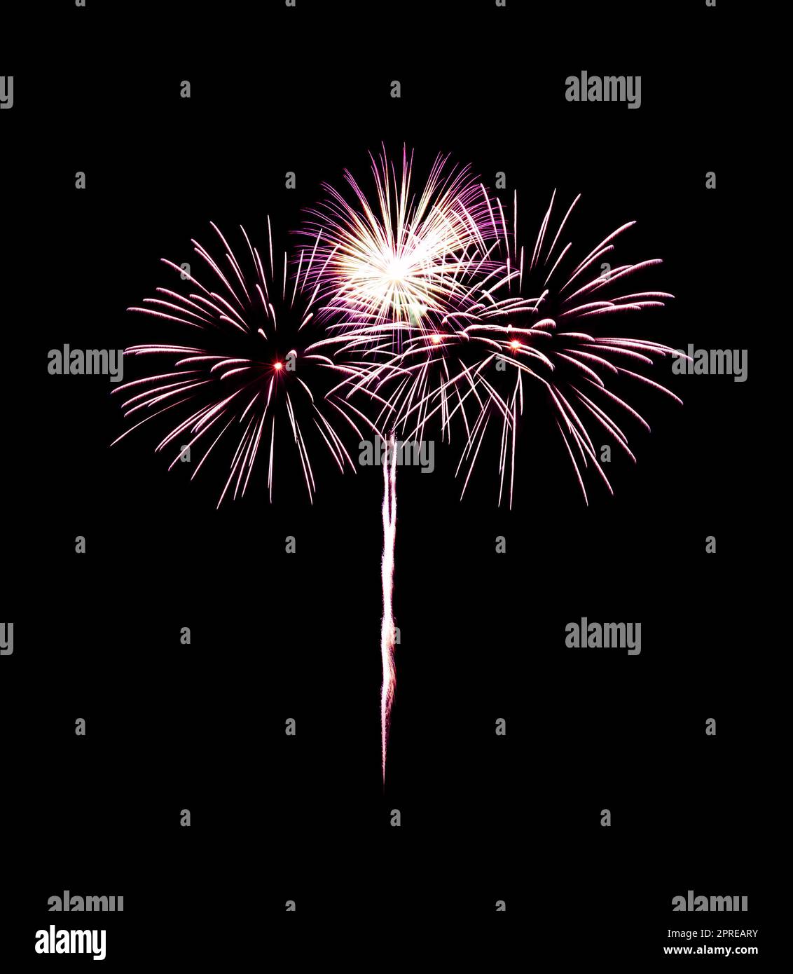 Beautiful colorful fireworks exploding in the night sky, isolated on black background. New year and anniversary concept. Stock Photo