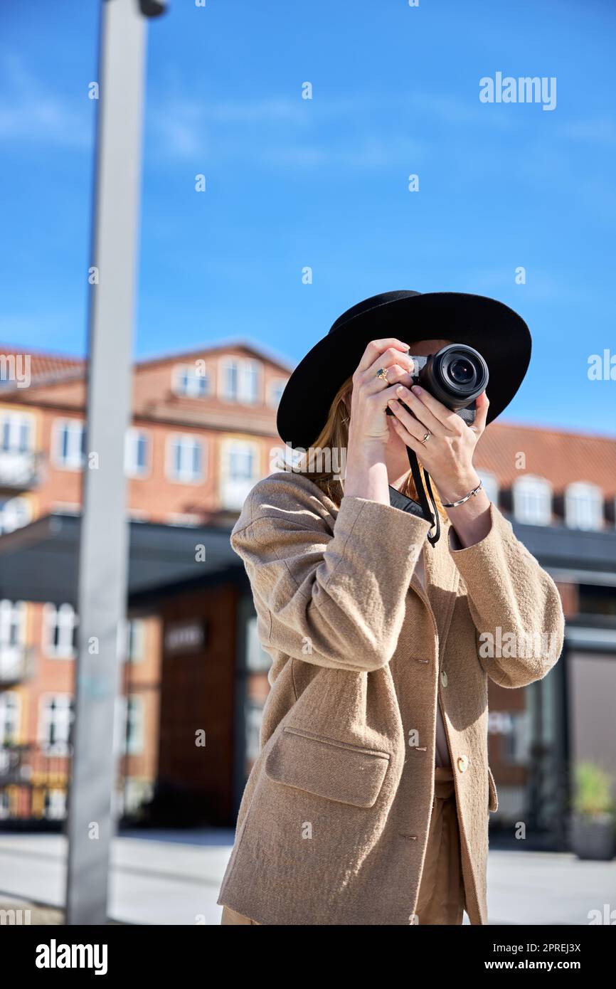 Young woman with taking photo in the city Stock Photo