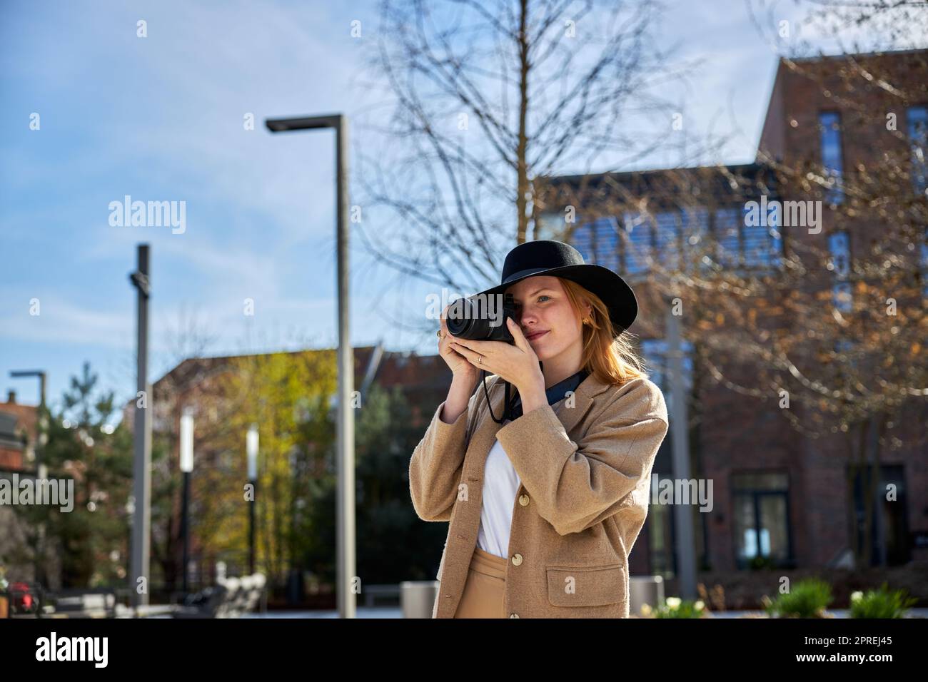 Young woman with taking photo in the city Stock Photo