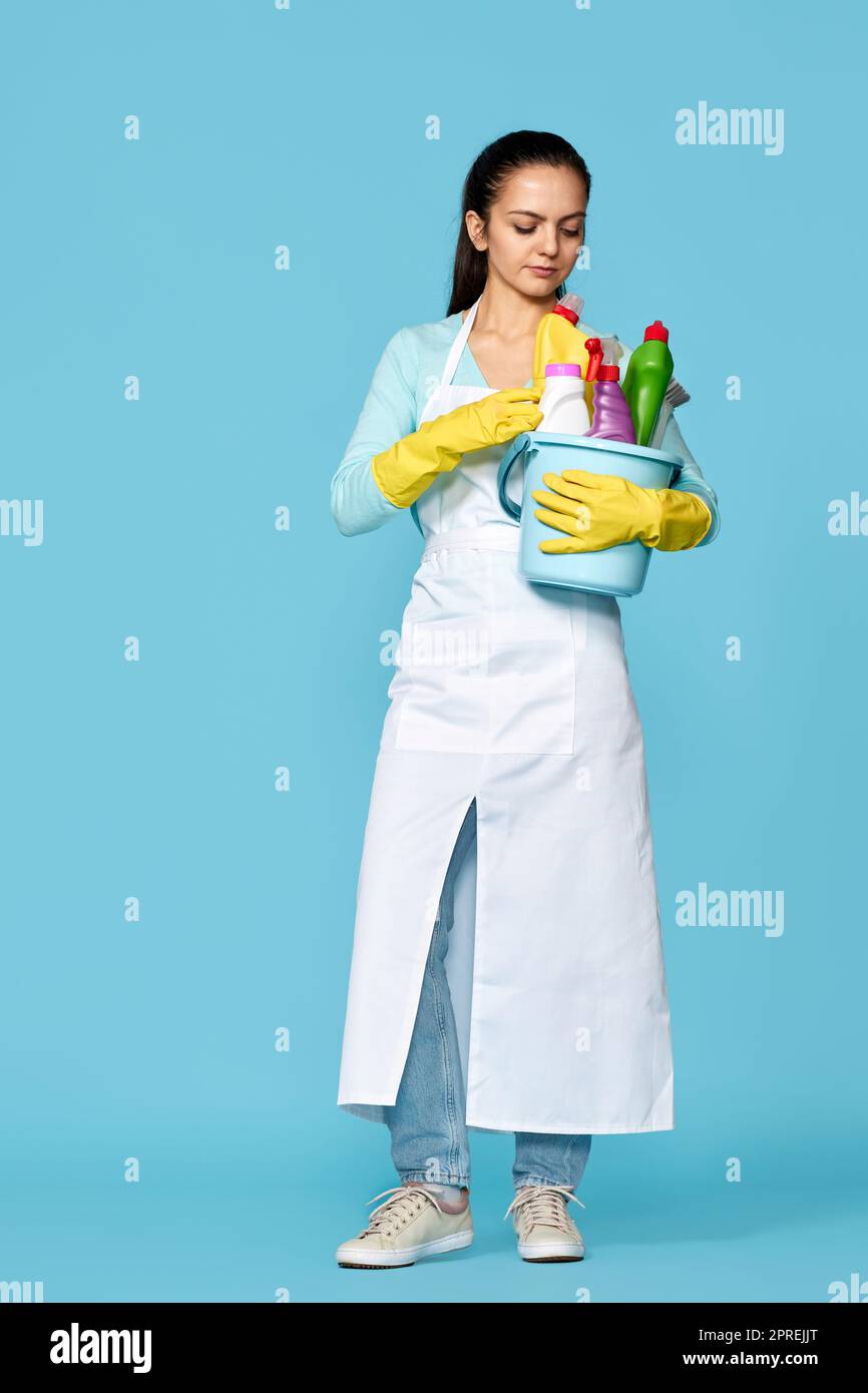 happy cheerful woman in rubber gloves and cleaner apron with cleaning ...