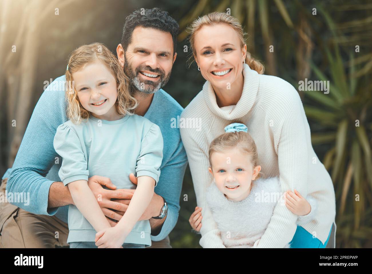 Family is forever. a family standing together in a yard Stock Photo - Alamy