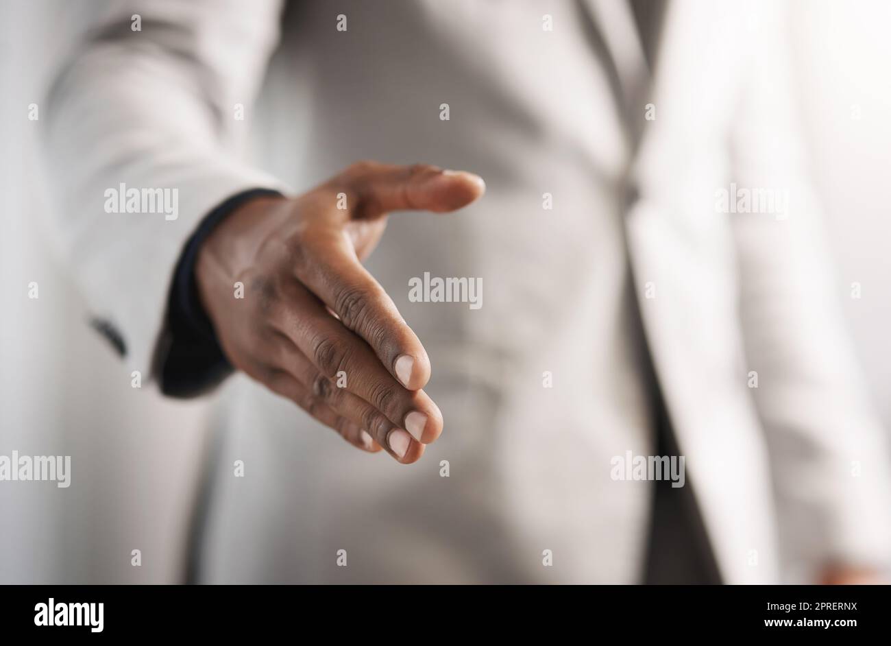 I would love to form a partnership with you. Closeup shot of an unrecognizable businessman extending a handshake. Stock Photo