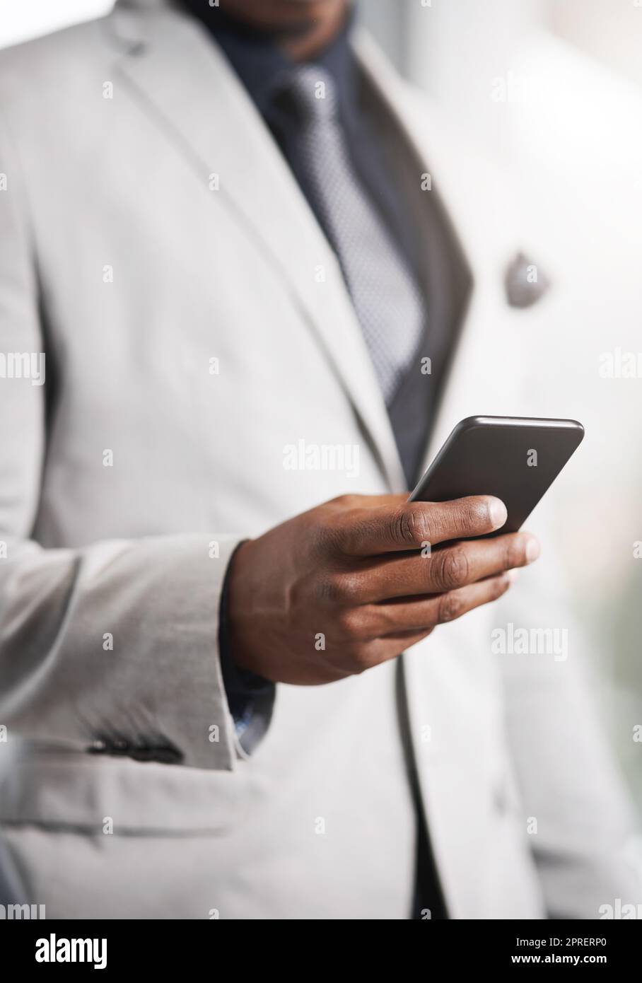 His gateway into keeping his lead in the business game. Closeup shot of an unrecognizable businessman using a cellphone. Stock Photo