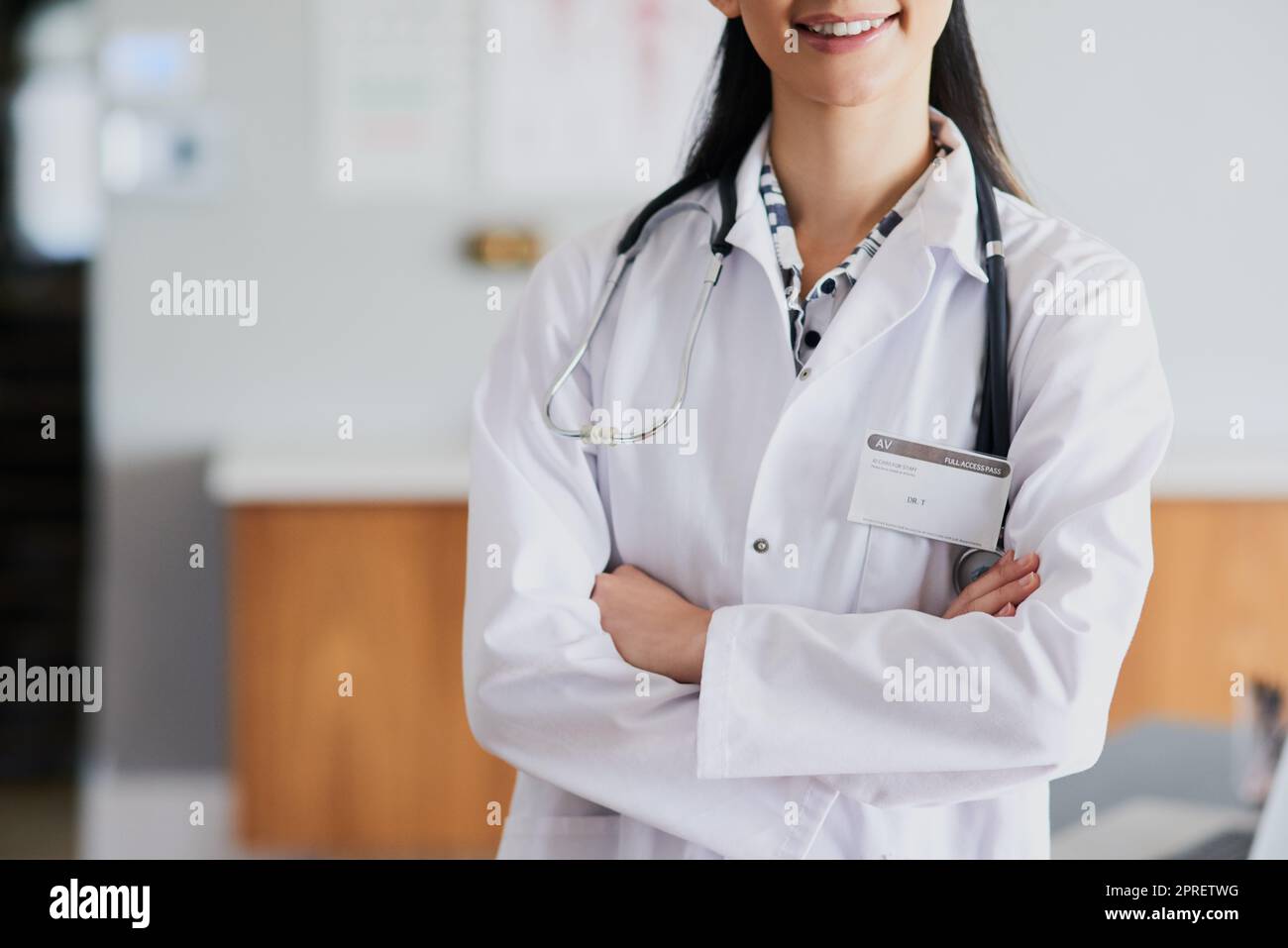 Capable Doctor Confident and capable. an unrecognizable female doctor standing with ...