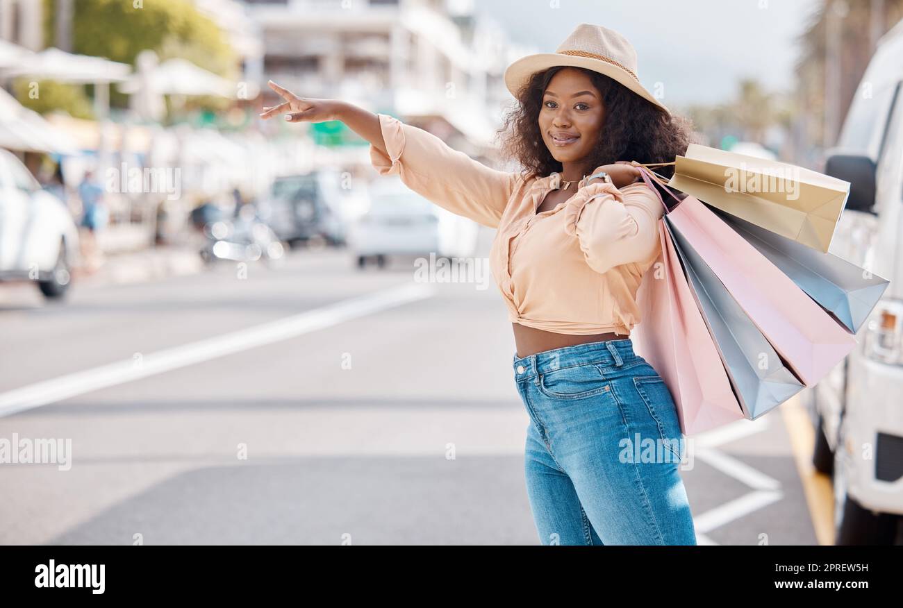 Retail, shopping and taxi with black woman in city for travel, luxury and fashion in urban