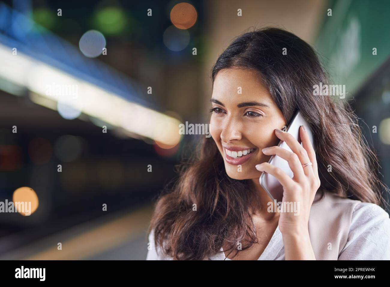 Commuting with a call. a young attractive woman on a call and using the train to commute. Stock Photo