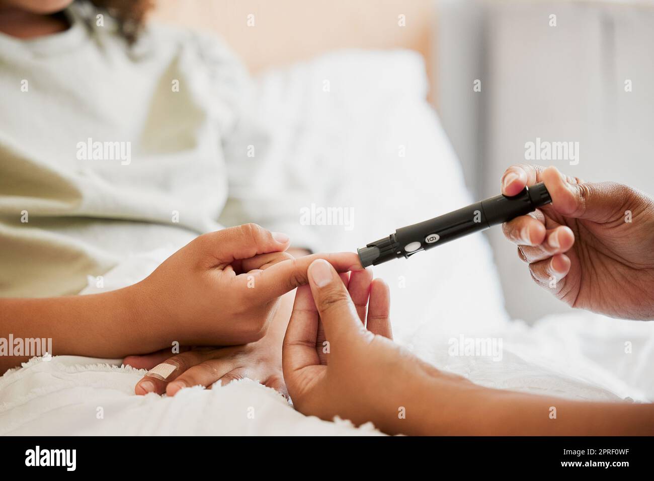 Diabetes, diabetic and mother testing blood sugar levels of a child