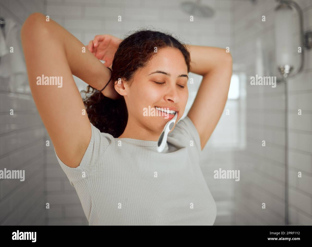 Health, grooming and brushing teeth for dental. oral hygiene with a young woman in bathroom at home. Female caring about the health of teeth and gums with a daily mouth and grooming cleaning routine Stock Photo