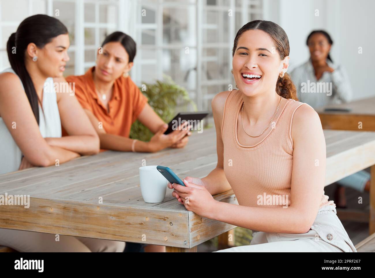 Texting on phone, networking and meeting friends for planning ideas, innovation and strategy for creative startup business. Portrait of woman with diverse group of businesswomen browsing social media Stock Photo