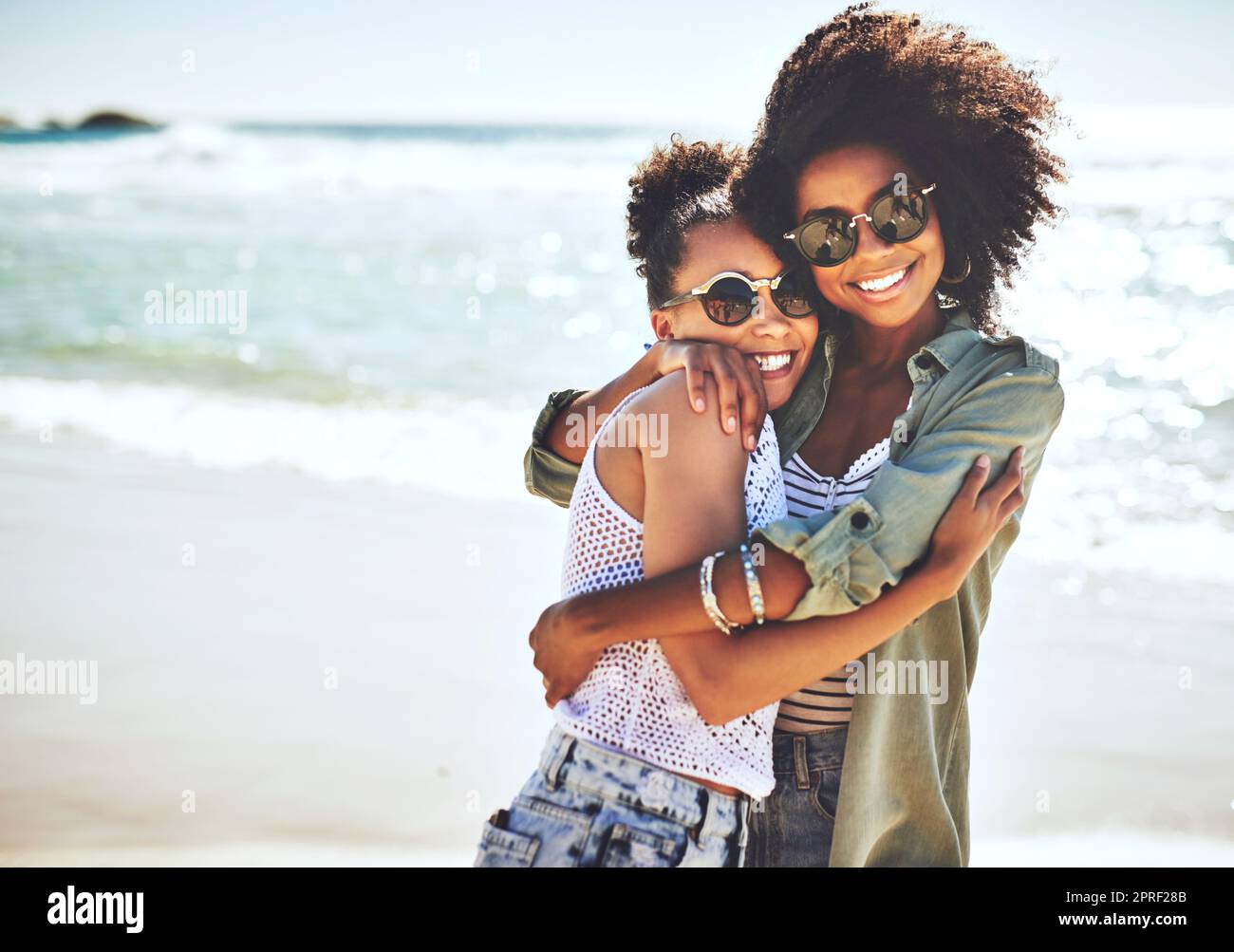 Shes my best friend and my chosen sister. two girlfriends enjoying themselves at the beach. Stock Photo