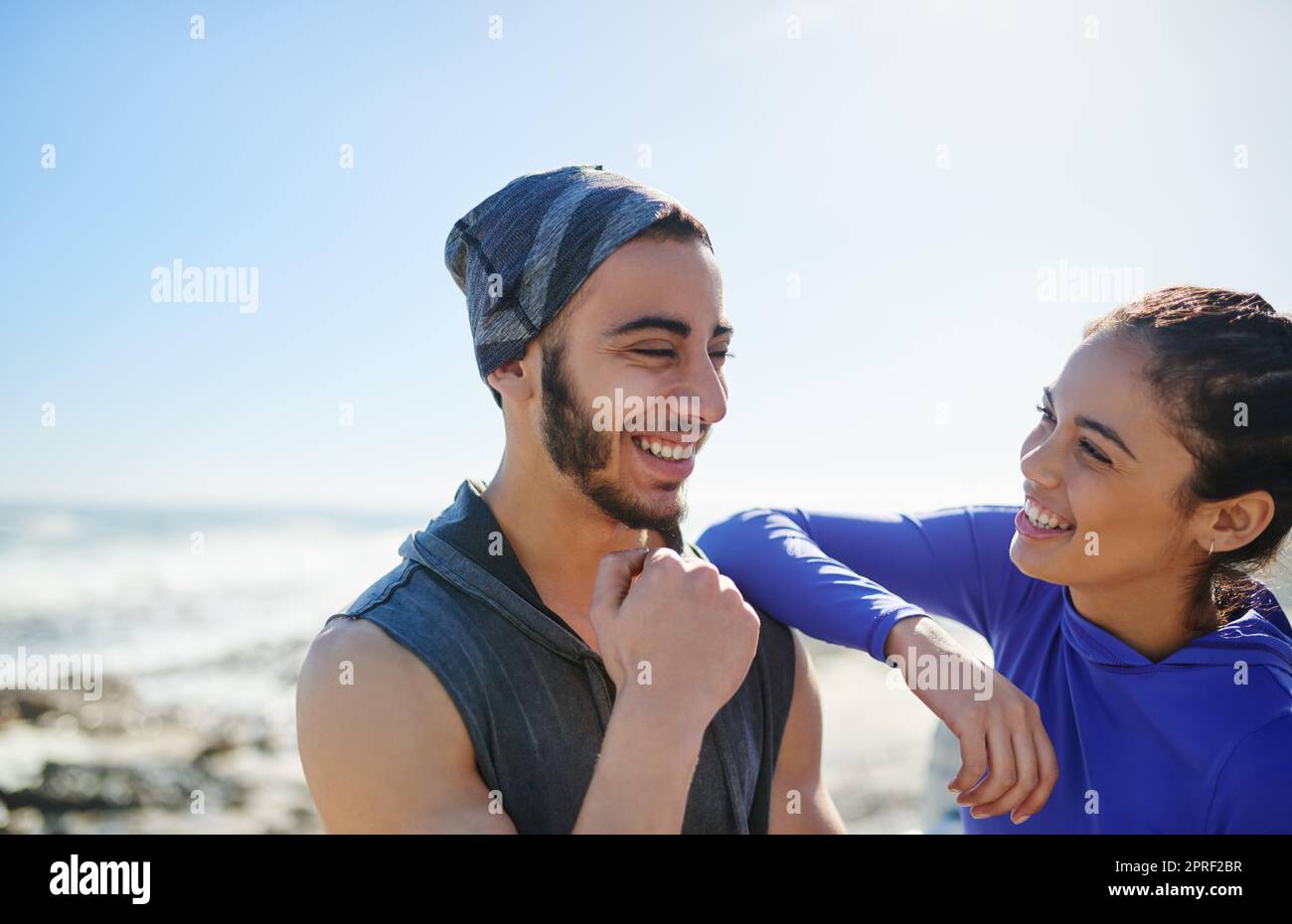 What a beautiful day to be out. two young cheerful friends hanging out together before a fitness exercise outside during the day. Stock Photo