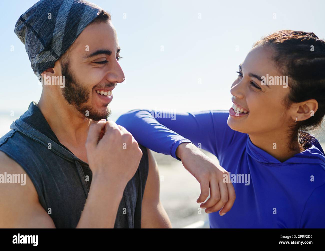 Are you ready for today. two young cheerful friends hanging out together before a fitness exercise outside during the day. Stock Photo