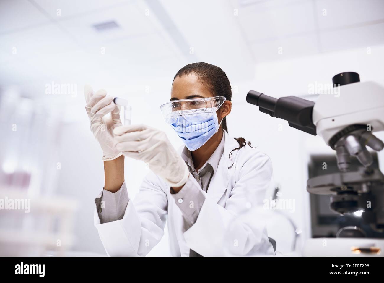 Testing a new hypothesis. a young scientist working in a lab. Stock Photo