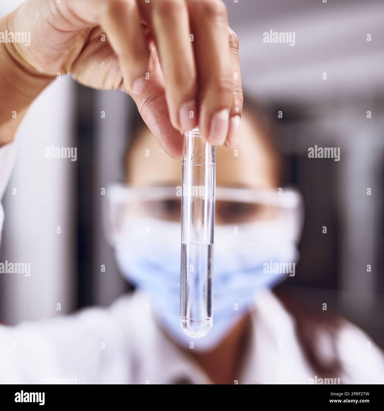 This could be the cure. a young scientist working in a lab. Stock Photo