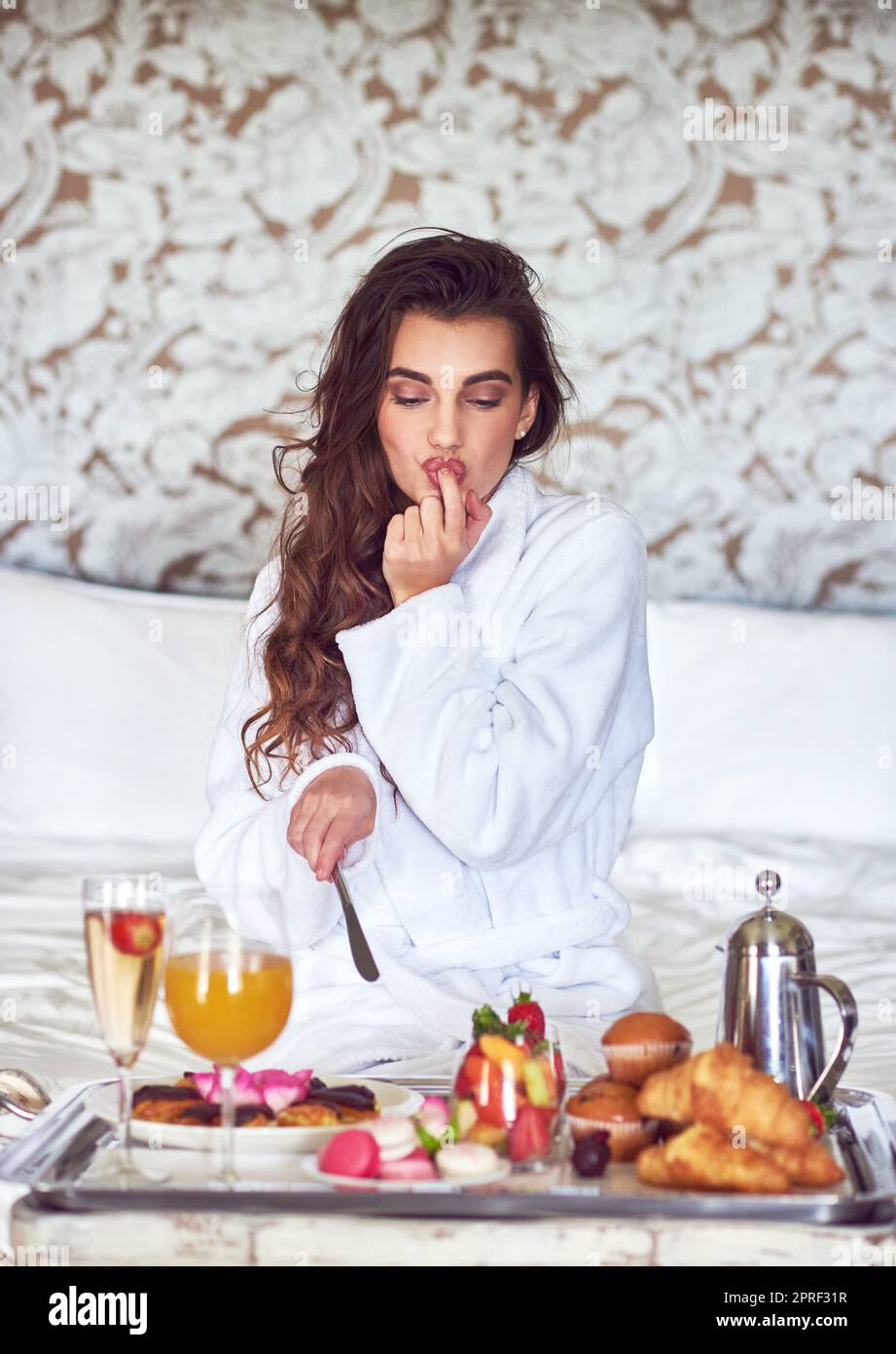 Theres nothing like a good breakfast to make your day. Full length shot of  an attractive young woman enjoying breakfast in bed while at home Stock  Photo - Alamy