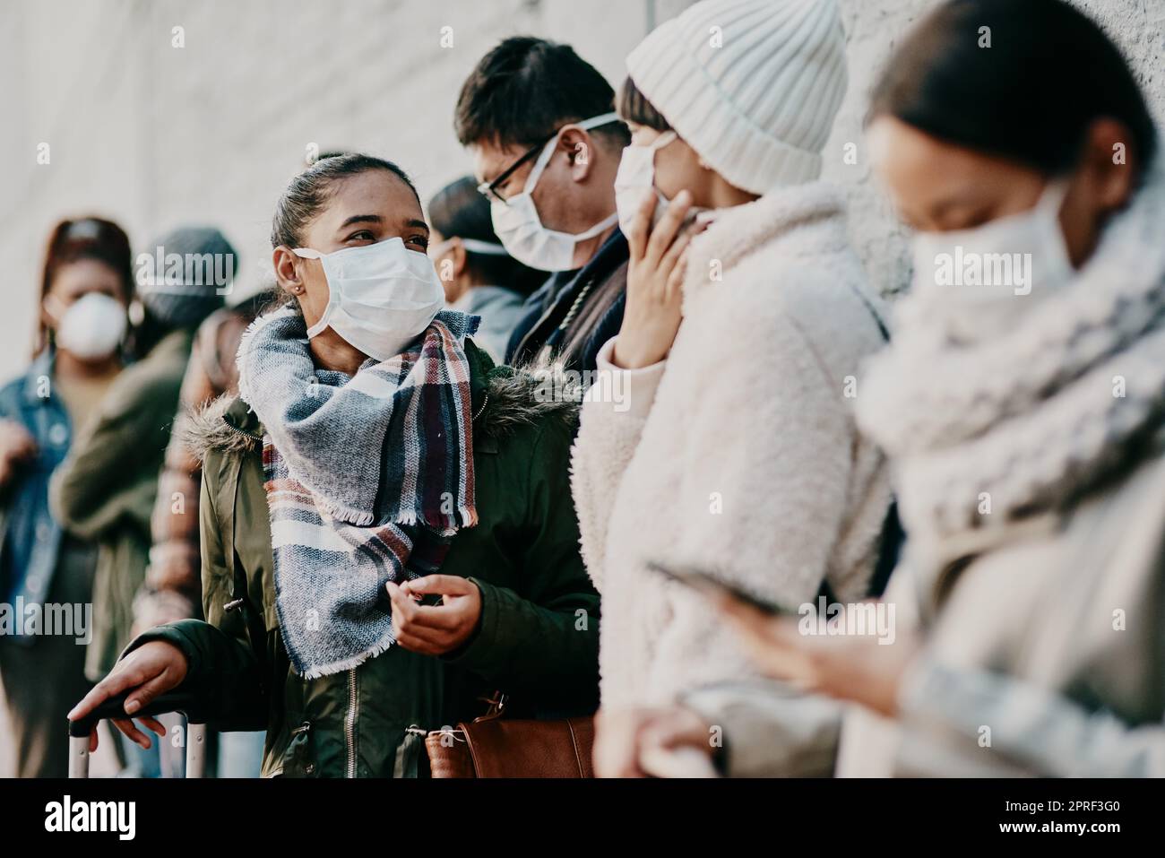 Travel restriction, Covid and face mask requirement for protection. Illness and public safety problems with commute in crowd. Risk of infection with global sickness or international disease. Stock Photo