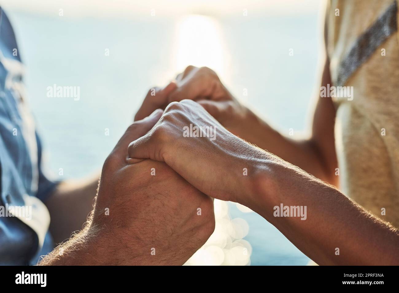 I cant imagine being with anyone else. an unrecognizable couple holding hand. Stock Photo
