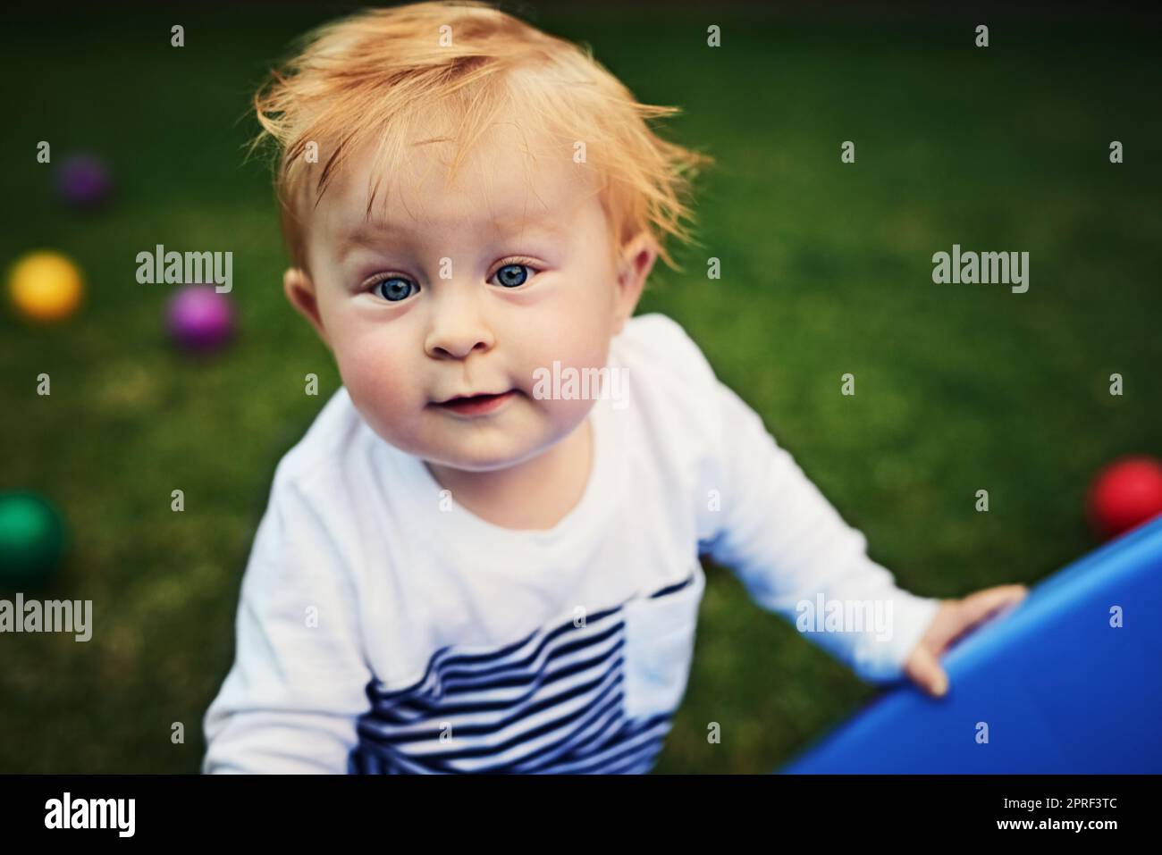 Little boys just want to have fun. an adorable little boy playing in the backyard. Stock Photo