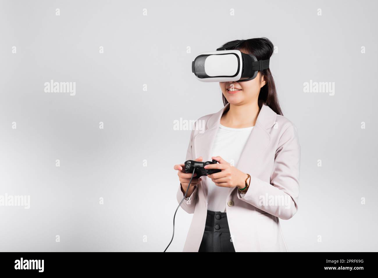 Smile woman confidence excited wear 3D VR headset device and playing