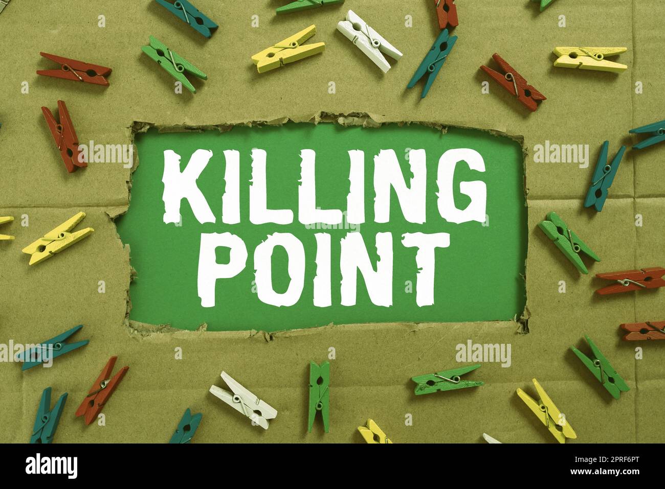 Writing displaying text Killing Point. Business approach Phase End Review Stage Gate Project Evaluation No Go Important Ideas Written Under Ripped Cardboard With Colored Pegs Around. Stock Photo