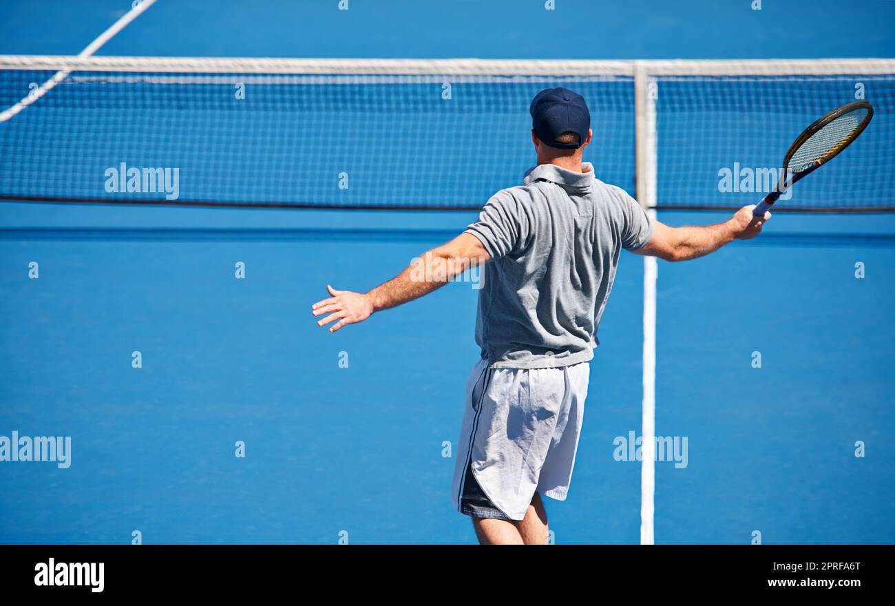 Showing up to every tennis practice. a man trying to return a ball on a