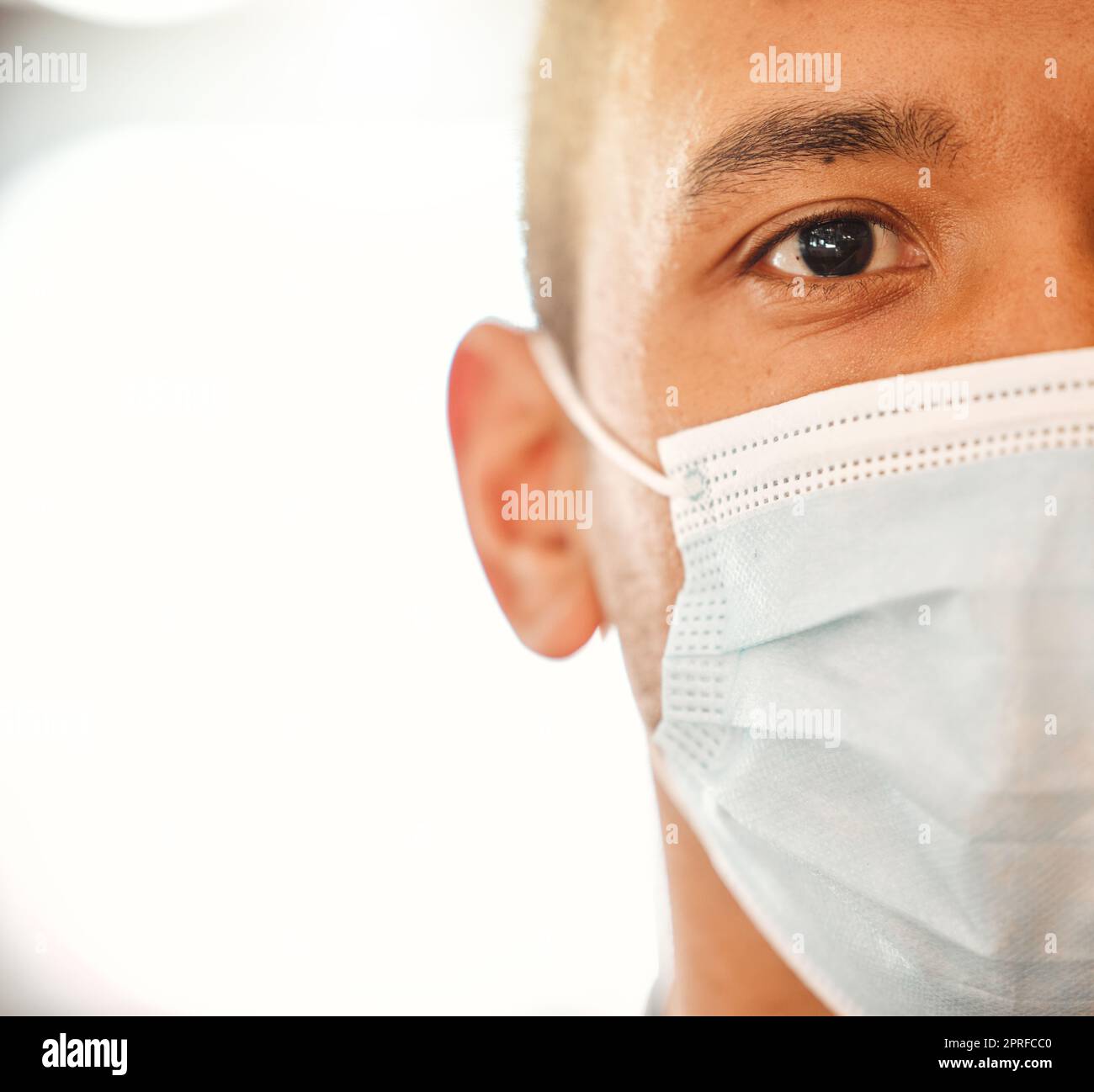 Covid, mask and closeup portrait for healthcare copy space background. Doctor, nurse or person wearing face protection of their health. Hospital safety for people at risk of infection medical advert. Stock Photo